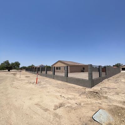 Block wall with wrought iron view fencing, Arizona City
