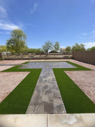Paver walkway running from the patio slab out to the main paver patio