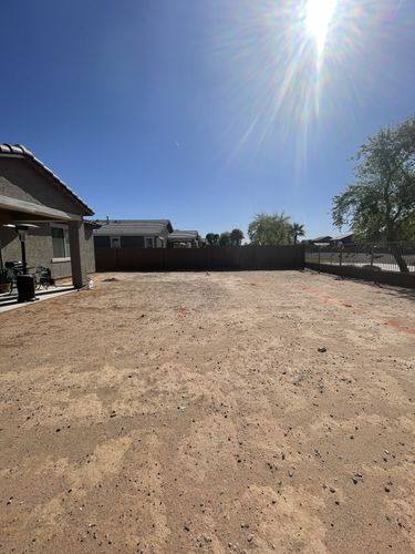 Backyard before renovation looking toward the wrought iron view fence