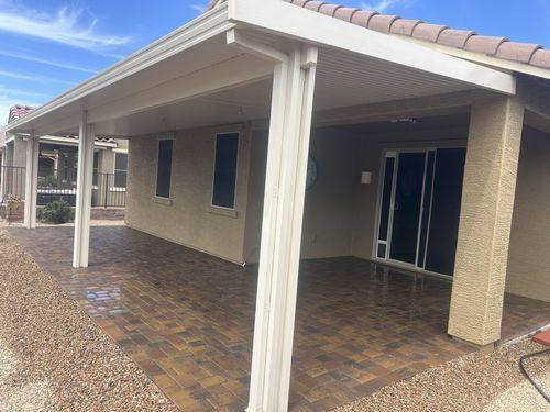 Paver patio filling the full area under the Alumawood-style patio cover
