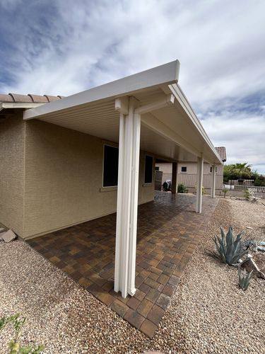 Corner view of the completed paver patio and patio cover
