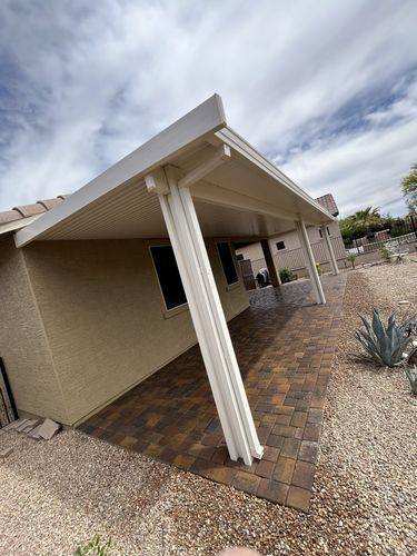 Paver patio extension seen from under the patio cover