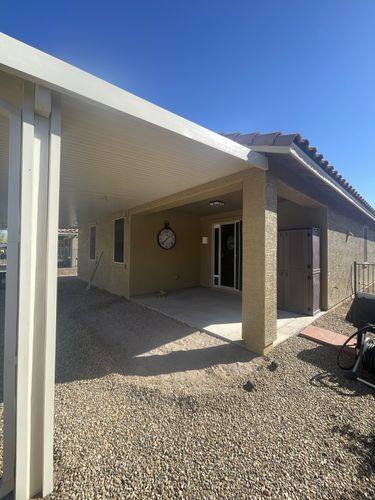 Alumawood-style patio cover before the paver extension, seen from the yard