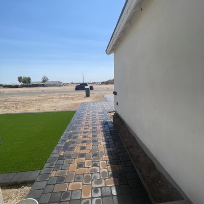 Tan and charcoal paver walkway along the house, Eloy