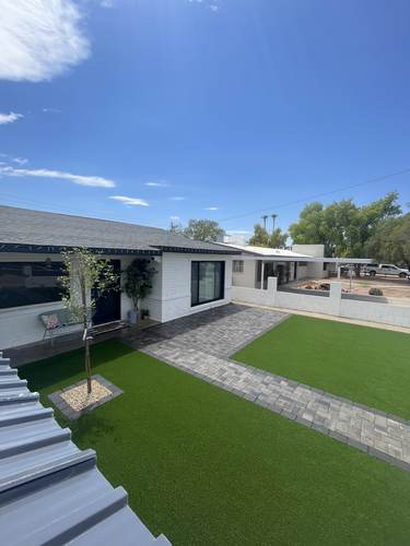 Front yard artificial turf and paver walkway