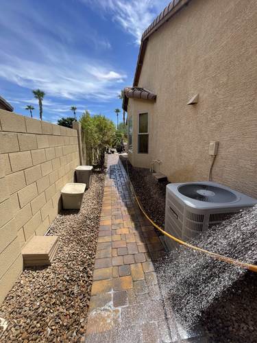 Side yard paver walkway alongside the home