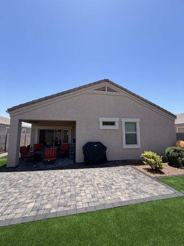 Finished slate gray paver patio across the back of the house in Casa Grande, AZ