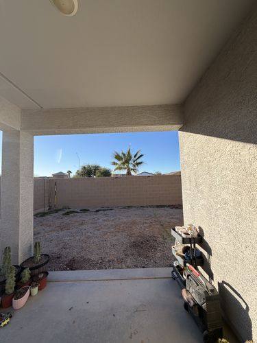 Looking out from under the covered patio before the pavers went in