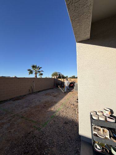 Backyard layout marked out in green paint before construction